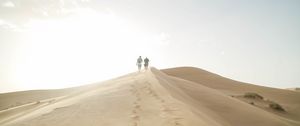 Preview wallpaper desert, people, sand, hills, walk