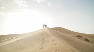 Preview wallpaper desert, people, sand, hills, walk