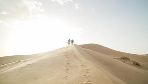 Preview wallpaper desert, people, sand, hills, walk