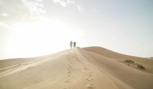 Preview wallpaper desert, people, sand, hills, walk