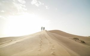 Preview wallpaper desert, people, sand, hills, walk