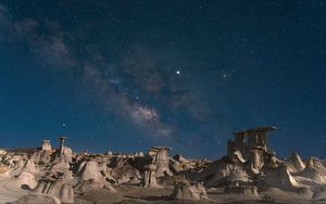 Preview wallpaper desert, rocks, landscape, starry sky, night