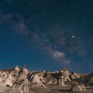 Preview wallpaper desert, rocks, landscape, starry sky, night