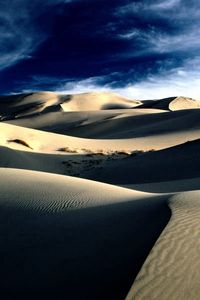 Preview wallpaper desert, sand, dunes, shades, mountains, lines, clouds, sky