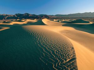 Preview wallpaper desert, sand, dunes, mountains, clouds, sky, emptiness