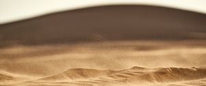 Preview wallpaper desert, sand, hill, dust, particles