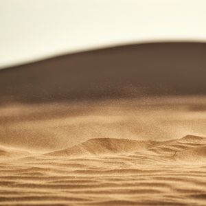 Preview wallpaper desert, sand, hill, dust, particles