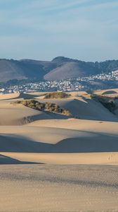 Preview wallpaper desert, sand, hills, city, landscape