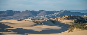 Preview wallpaper desert, sand, hills, city, landscape