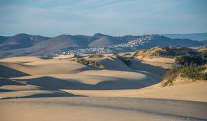 Preview wallpaper desert, sand, hills, city, landscape