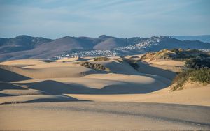 Preview wallpaper desert, sand, hills, city, landscape