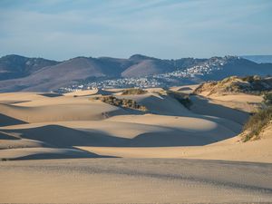 Preview wallpaper desert, sand, hills, city, landscape
