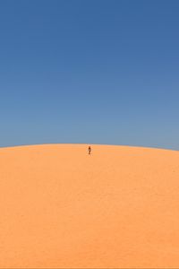 Preview wallpaper desert, sand, man, hill, sky, clean