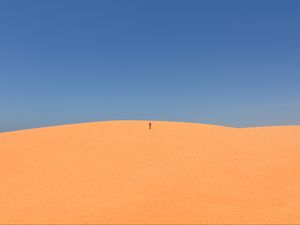 Preview wallpaper desert, sand, man, hill, sky, clean