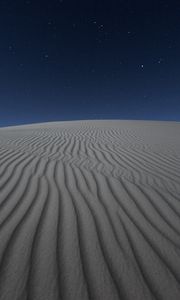 Preview wallpaper desert, sand, night, starry sky, light, wavy