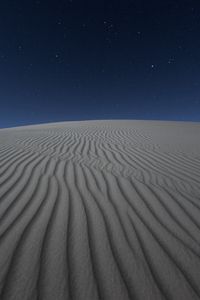 Preview wallpaper desert, sand, night, starry sky, light, wavy