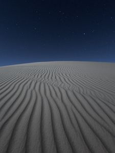 Preview wallpaper desert, sand, night, starry sky, light, wavy