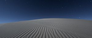 Preview wallpaper desert, sand, night, starry sky, light, wavy