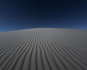 Preview wallpaper desert, sand, night, starry sky, light, wavy