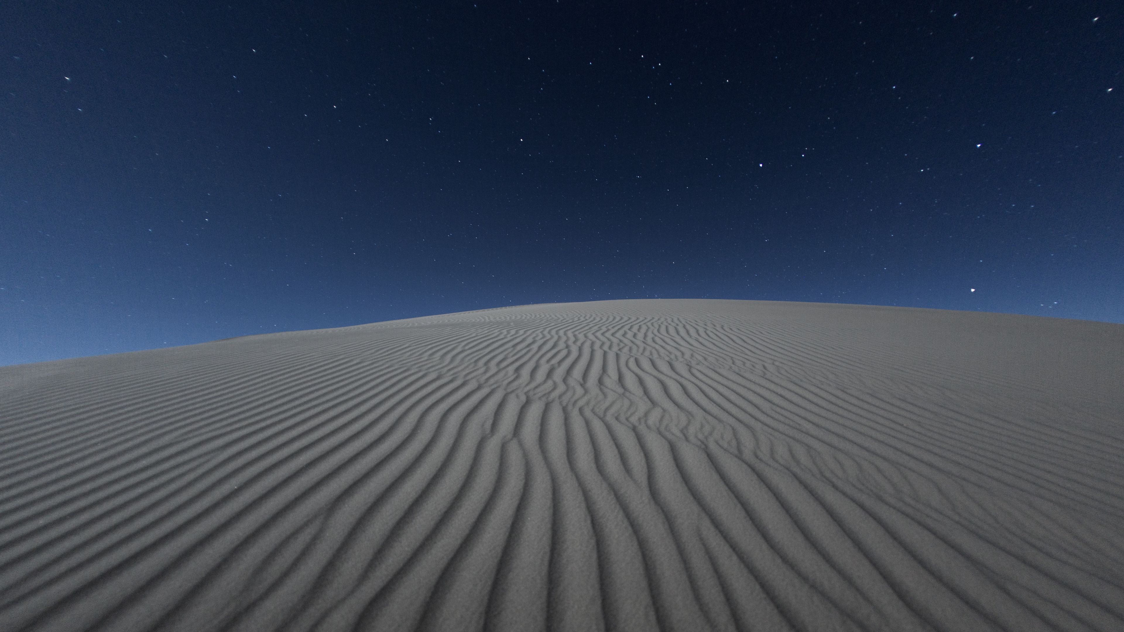 Download wallpaper 3840x2160 desert, sand, night, starry sky, light, wavy 4k  uhd 16:9 hd background