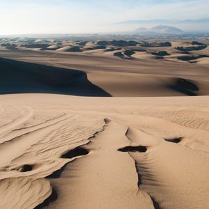 Preview wallpaper desert, sand, traces, distance