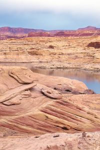 Preview wallpaper desert, sea, canyons, land, coast, stones