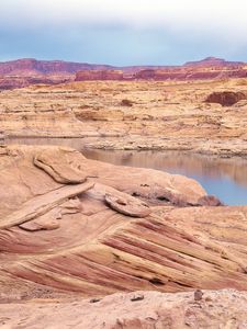 Preview wallpaper desert, sea, canyons, land, coast, stones