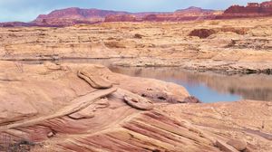 Preview wallpaper desert, sea, canyons, land, coast, stones