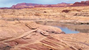 Preview wallpaper desert, sea, canyons, land, coast, stones