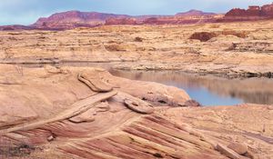 Preview wallpaper desert, sea, canyons, land, coast, stones