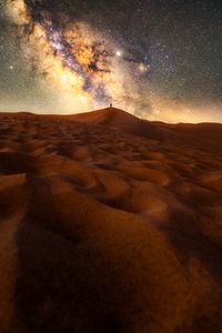 Preview wallpaper desert, silhouette, alone, starry sky, sand, night