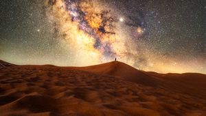 Preview wallpaper desert, silhouette, alone, starry sky, sand, night
