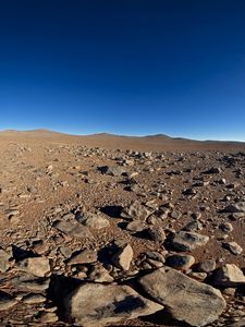 Preview wallpaper desert, stones, sand, sun