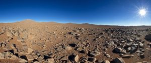 Preview wallpaper desert, stones, sand, sun