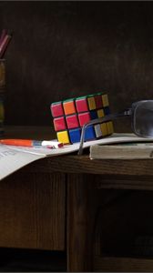 Preview wallpaper desk, glasses, instruction, rubiks cube