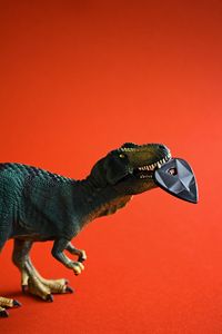 Preview wallpaper dinosaur, toy, pick