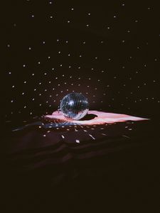 Premium Photo | Illuminated by sun light silver disco mirror ball. dark  black background and cold blue and purple shadows. party classic  decoration. boho style decor