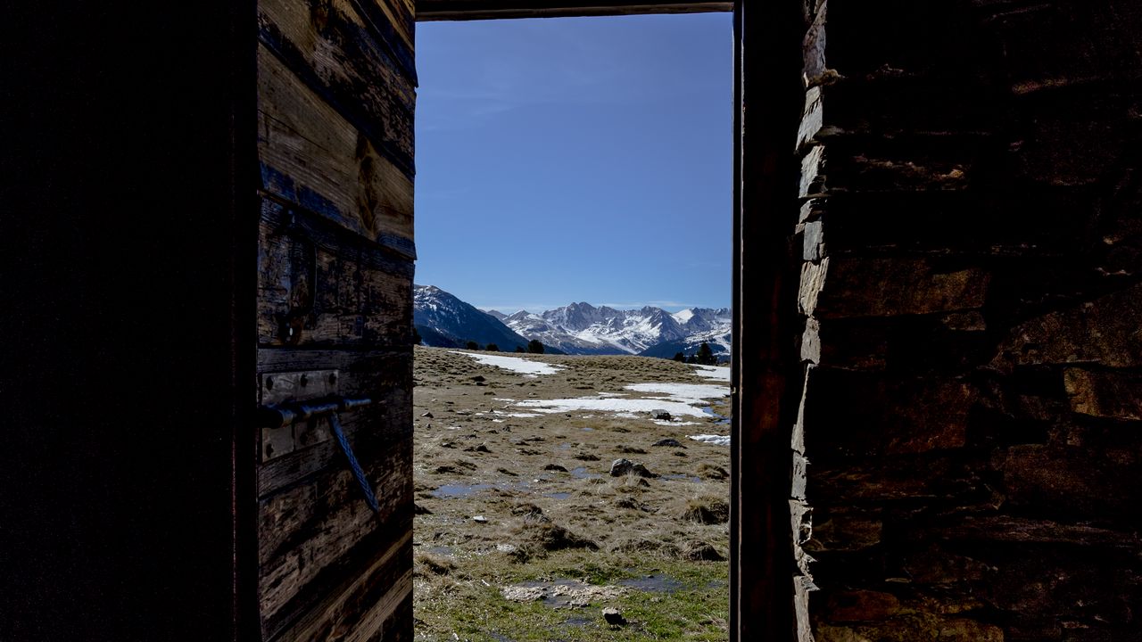 Wallpaper door, stones, grass, mountains, nature