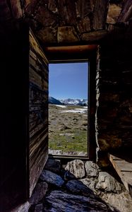 Preview wallpaper door, stones, grass, mountains, nature