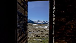 Preview wallpaper door, stones, grass, mountains, nature