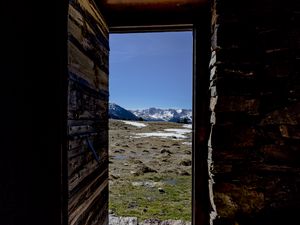 Preview wallpaper door, stones, grass, mountains, nature