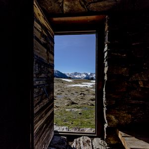 Preview wallpaper door, stones, grass, mountains, nature