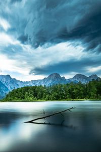 Preview wallpaper driftwood, lake, mountains, sky, clouds