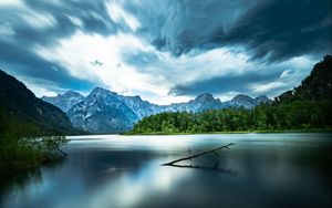 Preview wallpaper driftwood, lake, mountains, sky, clouds