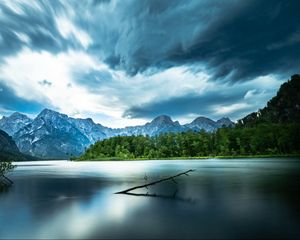 Preview wallpaper driftwood, lake, mountains, sky, clouds