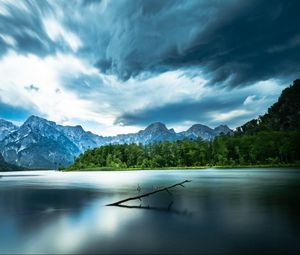 Preview wallpaper driftwood, lake, mountains, sky, clouds