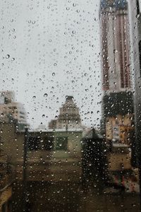 Preview wallpaper drops, rain, window, city, glass