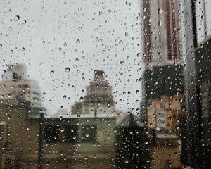 Preview wallpaper drops, rain, window, city, glass