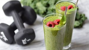 Preview wallpaper dumbbells, smoothies, raspberry, sports nutrition