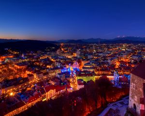 Preview wallpaper dusk, evening, lights, home, castle, mountains, alps, christmas, slovenia